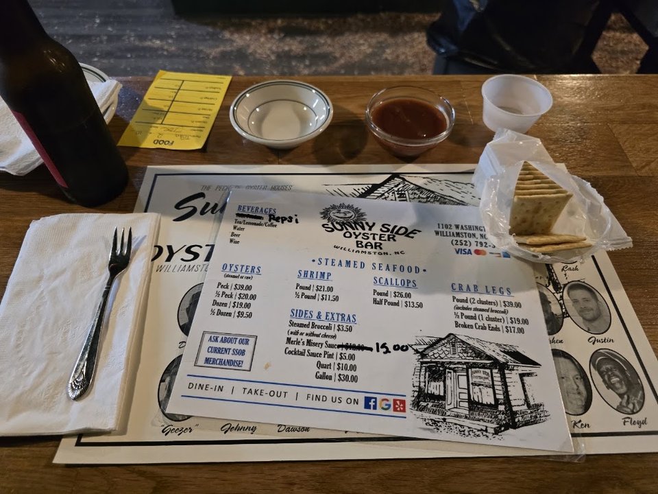 Printed seafood menu with beer and beverages.